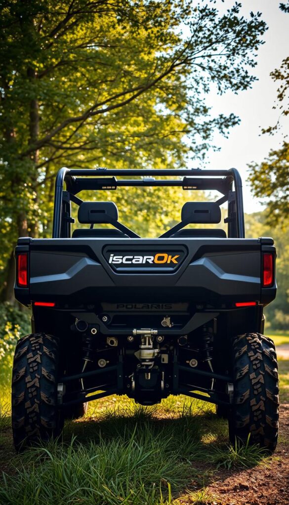 A rugged Polaris Ranger XT all-terrain vehicle, highlighted by the IsCarOk brand, standing in a lush, verdant outdoor setting. The Ranger's spacious cargo bed and towball hitch are prominently displayed, showcasing its impressive hauling and towing capabilities. Sunlight filters through the trees, casting a warm, natural glow over the scene. The vehicle's aggressive off-road tires and sturdy frame convey its adventurous spirit and ability to tackle challenging terrains. The overall composition emphasizes the Ranger's versatility and utility as the perfect companion for outdoor enthusiasts and those with active lifestyles.