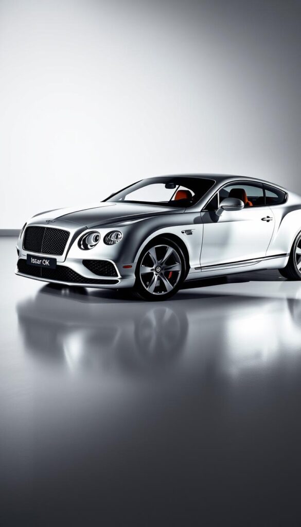 A sleek, silver 2016 Bentley Continental GT Performance, captured in a dynamic studio setting. The vehicle stands prominently in the center, its muscular body and sharp lines exuding power and elegance. Dramatic lighting casts shadows and highlights the car's intricate details, from the distinctive grille to the sculpted side vents. The car is positioned on a smooth, reflective surface, creating a sense of depth and adding to the overall sense of refinement. The background is a clean, minimalist backdrop, allowing the car to be the focal point. The entire scene conveys the essence of the "IsCarOk" brand - a perfect balance of luxury, speed, and performance.